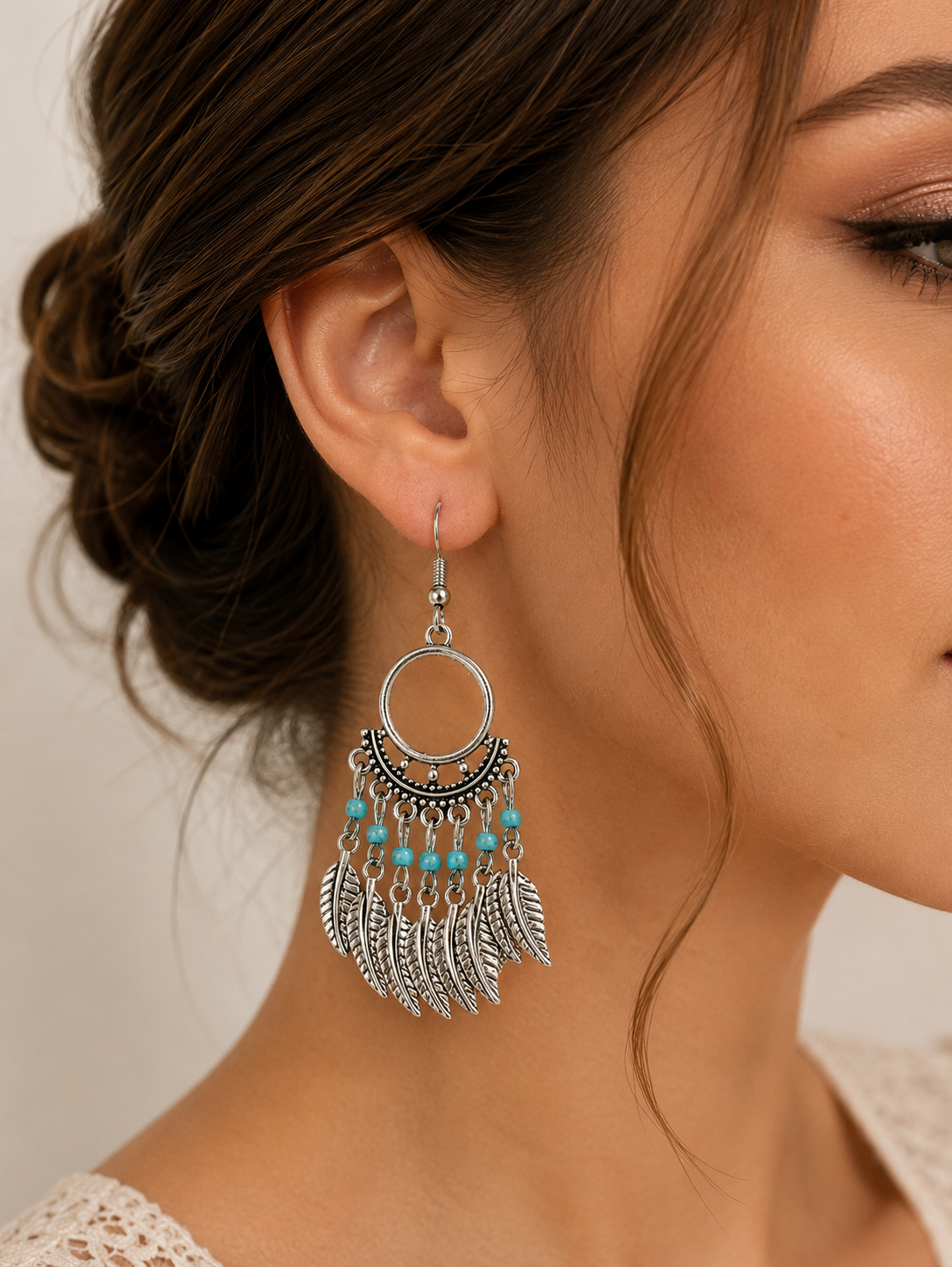 Aretes de fantasía bohemios con turquesa y plumas