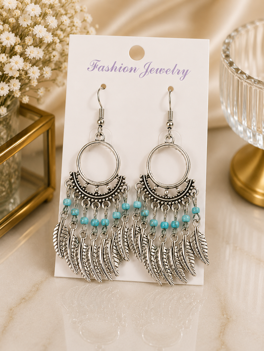Aretes de fantasía bohemios con turquesa y plumas